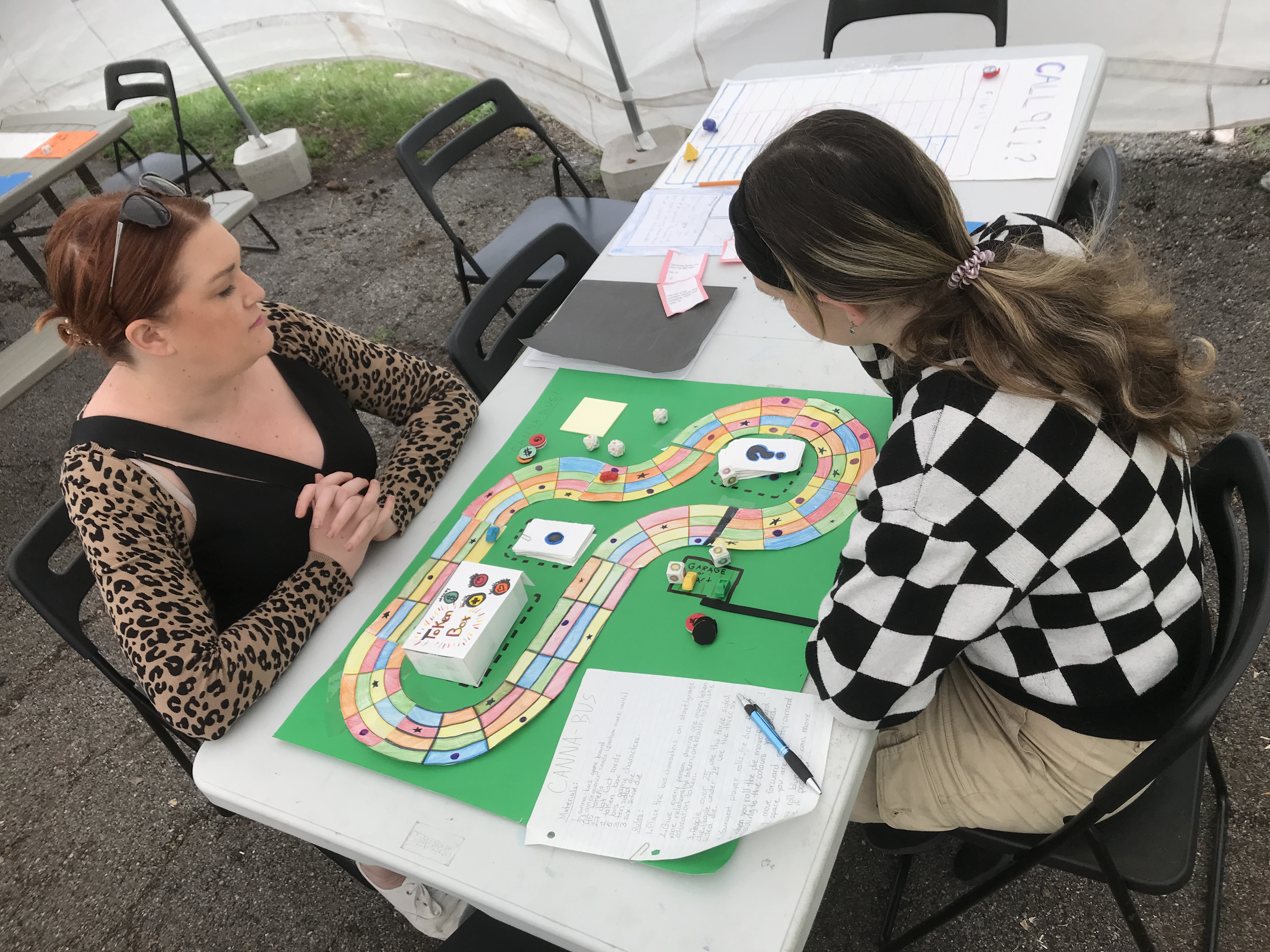 A parent trying out a student's game about marijuana use and abuse.